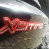 Kymco Xciting 500R ABS luksusowa budetowka - Xciting logo