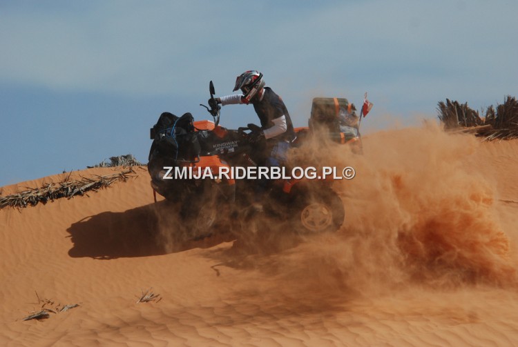 Riding_on_ATV_past_Sahara